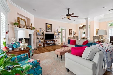 Living area featuring a fireplace, crown molding, 