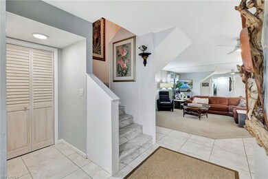 Staircase featuring ceiling fan, carpet flooring, 