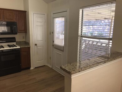 Another view of kitchen looking onto the covered d