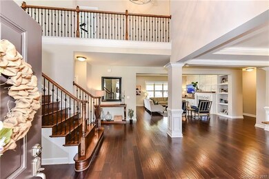 Beautiful double front doors open to a stunning en
