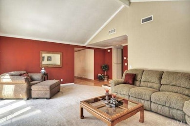 A shot from inside the living room give you an idea of the size this room features. The hallway to the left takes you into the kitchen and family room while the hallway to the right takes you into the bedrooms and bathrooms. 