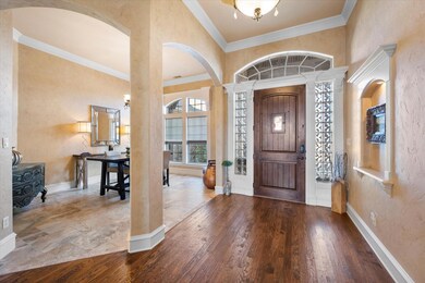 Foyer entrance with hardwood / wood-style flooring