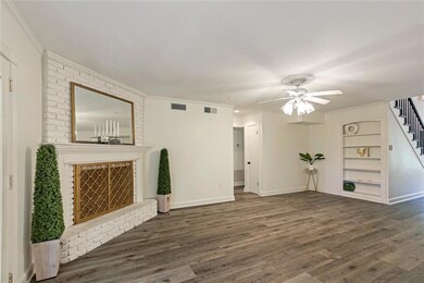 Large Den with Wood Floors, Brick Fireplace & Hear