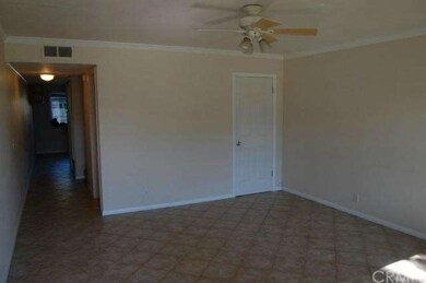 Tile floors, crown moulding, ceiling fan