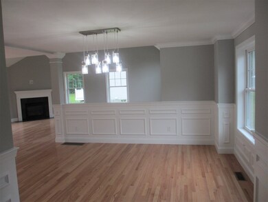Lovely features such as the wainscotting, crown mo