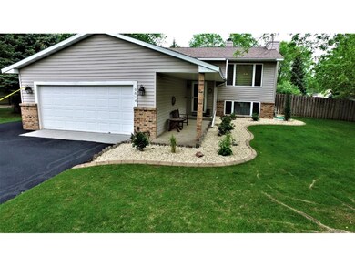 This home has a large asphalt driveway that extend