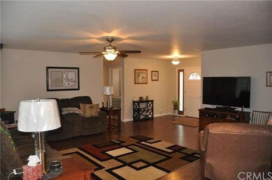 Spacious living room with welcoming entry way.  