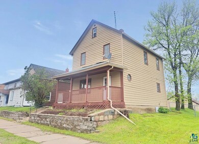 View of front of property featuring a front yard a