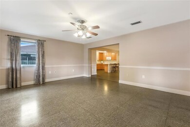 SPACIOUS FAMILY ROOM WITH TERRAZZO FLOORS