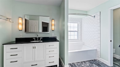 Primary bathroom wows with it's high end finishes and functionality.