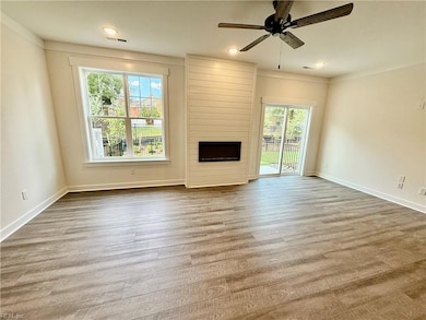 family room with linear fireplace and lots of light
