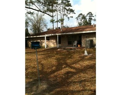 Exterior Back. Enjoy the covered patio and back ya