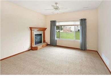 The large living room with carpet that is glued do