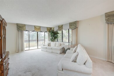 Alternate view of family room showcasing bright wi