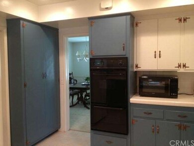 Kitchen opens to formal dining room.