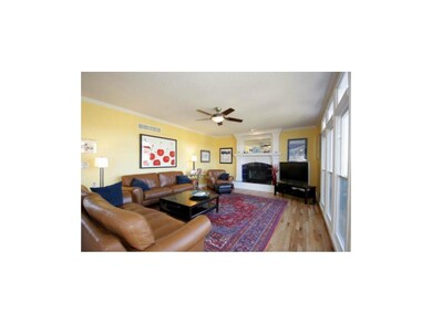 Large great room with detail trim surrounding fire