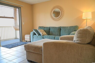 Living room featuring light tile patterned floors