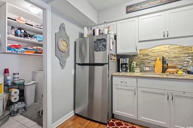 Kitchen featuring tasteful backsplash, sink, stain