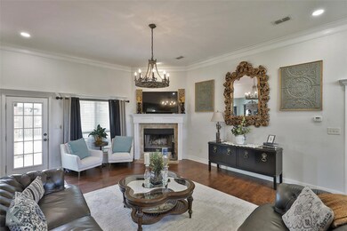 Living room featuring an inviting chandelier, crow