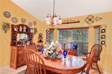 Formal dining room features a bump out allowing mo
