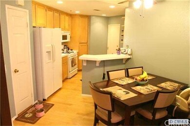 Off the living room pass the dining area and head 