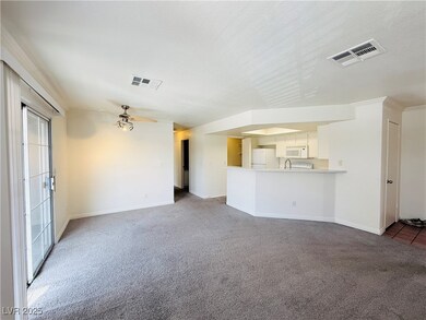 Unfurnished living room featuring baseboards, visi