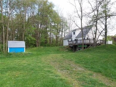 REAR OF HOUSE WITH WALK OUT BASEMENT AND WRAP AROU