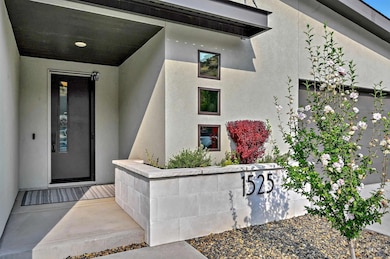 Entrance to property featuring stucco siding