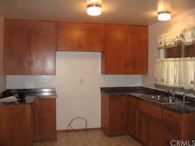 Kitchen with refinished cabinets and counter tops.