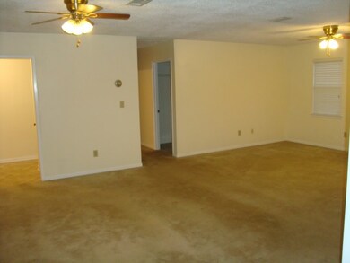 Large living room opens onto deck for entertaining