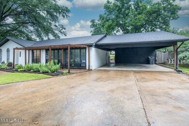 Carport Features 2 Storage Rooms!