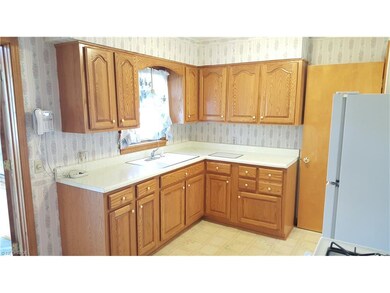 Another view of the oak cabinets with the large si