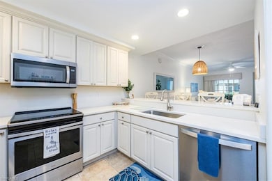 Kitchen with stainless steel appliances, quartz co