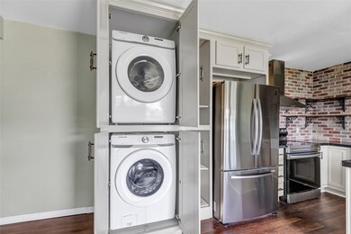 This photo shows a modern kitchen with a stacked w