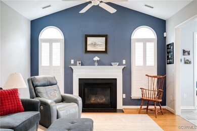 Living Room with Hardwood Floors, Fireplace, and C