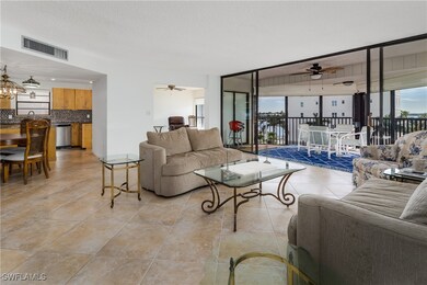 Living room featuring light tile patterned floors,