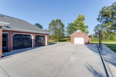 A spacious attached garage provides secure parking for two vehicles.  Fantastic basketball goal with ample space for playing basketball outdoors.
