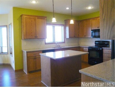 Light filled kitchen has window over kitchen sink,