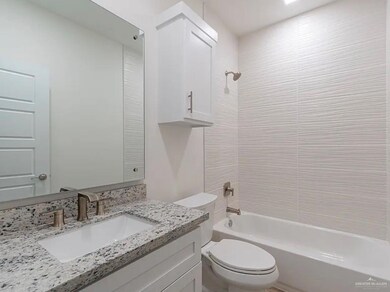 Bathroom with toilet, vanity, and bathing tub / shower combination
