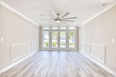 Unfurnished room featuring french doors, ornamenta
