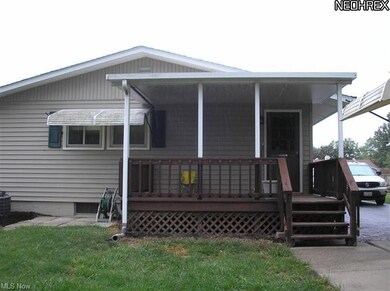 Back of home with deck