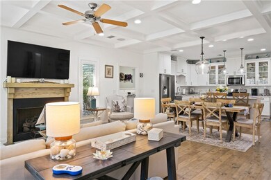 Open main living area, fireplace, and kitchen