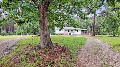 Ranch-style home with crawl space and a front yard