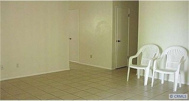 living room with tile flooring