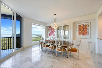 Dining space with ornamental molding and ceiling f