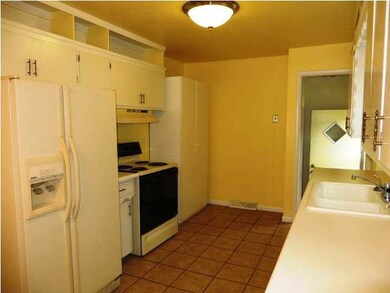 The kitchen offers plenty of storage and updated t