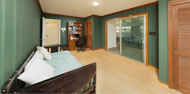  THE DEN/OFFICE OPENS INTO THE KITCHEN AND THE REC