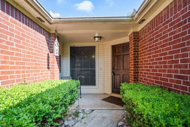 Walking up to the front door we can see the covered porch allows for a cozy seating area if desired, perfect for enjoying fresh air watching the cars drive by.