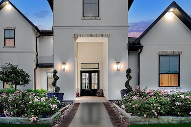 Stunning entryway showcasing a home located in a private gated community.