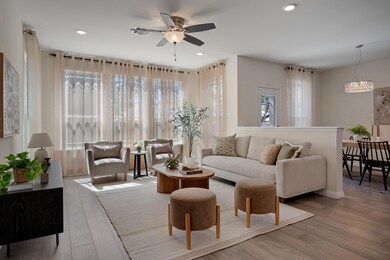 Living area with visible vents, recessed lighting